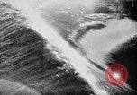 Image of ocean waves on rocky shores Vietnam, 1925, second 28 stock footage video 65675044076