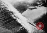 Image of ocean waves on rocky shores Vietnam, 1925, second 29 stock footage video 65675044076