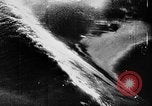 Image of ocean waves on rocky shores Vietnam, 1925, second 30 stock footage video 65675044076