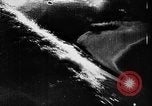 Image of ocean waves on rocky shores Vietnam, 1925, second 32 stock footage video 65675044076