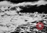 Image of ocean waves on rocky shores Vietnam, 1925, second 62 stock footage video 65675044076