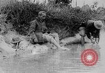 Image of Ho Chi Minh washes his feet Vietnam, 1942, second 8 stock footage video 65675044086