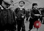 Image of Vietnamese children run to see event Vietnam, 1954, second 4 stock footage video 65675044095