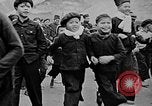 Image of Vietnamese children run to see event Vietnam, 1954, second 6 stock footage video 65675044095