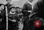 Image of Vietnamese children run to see event Vietnam, 1954, second 12 stock footage video 65675044095