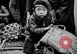 Image of Vietnamese children run to see event Vietnam, 1954, second 13 stock footage video 65675044095