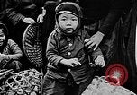Image of Vietnamese children run to see event Vietnam, 1954, second 14 stock footage video 65675044095