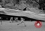 Image of Vietnamese children run to see event Vietnam, 1954, second 25 stock footage video 65675044095