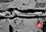 Image of Vietnamese children run to see event Vietnam, 1954, second 39 stock footage video 65675044095
