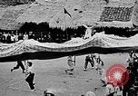Image of Vietnamese children run to see event Vietnam, 1954, second 41 stock footage video 65675044095