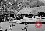 Image of Vietnamese children run to see event Vietnam, 1954, second 47 stock footage video 65675044095