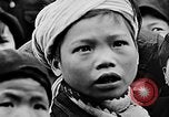 Image of Vietnamese children run to see event Vietnam, 1954, second 61 stock footage video 65675044095