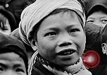 Image of Vietnamese children run to see event Vietnam, 1954, second 62 stock footage video 65675044095