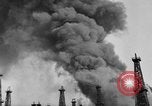 Image of blast in oil refinery Long Beach California USA, 1933, second 15 stock footage video 65675044362