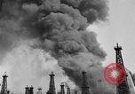 Image of blast in oil refinery Long Beach California USA, 1933, second 16 stock footage video 65675044362