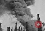 Image of blast in oil refinery Long Beach California USA, 1933, second 17 stock footage video 65675044362