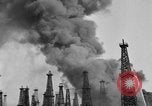 Image of blast in oil refinery Long Beach California USA, 1933, second 18 stock footage video 65675044362