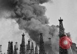 Image of blast in oil refinery Long Beach California USA, 1933, second 19 stock footage video 65675044362