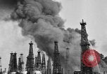 Image of blast in oil refinery Long Beach California USA, 1933, second 20 stock footage video 65675044362