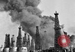 Image of blast in oil refinery Long Beach California USA, 1933, second 21 stock footage video 65675044362