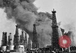 Image of blast in oil refinery Long Beach California USA, 1933, second 22 stock footage video 65675044362