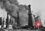 Image of blast in oil refinery Long Beach California USA, 1933, second 23 stock footage video 65675044362