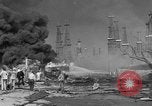 Image of blast in oil refinery Long Beach California USA, 1933, second 35 stock footage video 65675044362