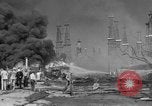 Image of blast in oil refinery Long Beach California USA, 1933, second 36 stock footage video 65675044362