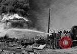 Image of blast in oil refinery Long Beach California USA, 1933, second 38 stock footage video 65675044362
