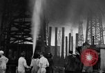 Image of blast in oil refinery Long Beach California USA, 1933, second 46 stock footage video 65675044362