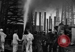Image of blast in oil refinery Long Beach California USA, 1933, second 47 stock footage video 65675044362