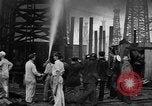 Image of blast in oil refinery Long Beach California USA, 1933, second 48 stock footage video 65675044362