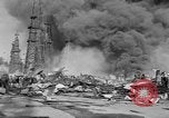 Image of blast in oil refinery Long Beach California USA, 1933, second 52 stock footage video 65675044362