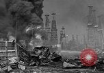 Image of blast in oil refinery Long Beach California USA, 1933, second 59 stock footage video 65675044362