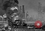 Image of blast in oil refinery Long Beach California USA, 1933, second 60 stock footage video 65675044362