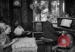 Image of family listening to radio broadcast Paris France, 1950, second 1 stock footage video 65675044610
