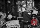 Image of family listening to radio broadcast Paris France, 1950, second 3 stock footage video 65675044610