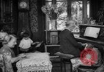 Image of family listening to radio broadcast Paris France, 1950, second 4 stock footage video 65675044610