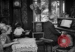 Image of family listening to radio broadcast Paris France, 1950, second 5 stock footage video 65675044610