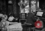Image of family listening to radio broadcast Paris France, 1950, second 7 stock footage video 65675044610