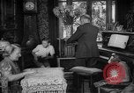 Image of family listening to radio broadcast Paris France, 1950, second 9 stock footage video 65675044610