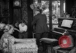 Image of family listening to radio broadcast Paris France, 1950, second 10 stock footage video 65675044610