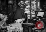 Image of family listening to radio broadcast Paris France, 1950, second 11 stock footage video 65675044610