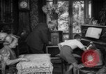 Image of family listening to radio broadcast Paris France, 1950, second 12 stock footage video 65675044610