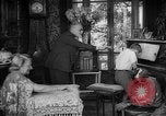 Image of family listening to radio broadcast Paris France, 1950, second 14 stock footage video 65675044610