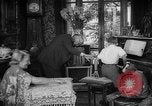 Image of family listening to radio broadcast Paris France, 1950, second 15 stock footage video 65675044610