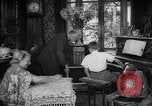 Image of family listening to radio broadcast Paris France, 1950, second 16 stock footage video 65675044610