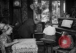 Image of family listening to radio broadcast Paris France, 1950, second 18 stock footage video 65675044610