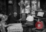 Image of family listening to radio broadcast Paris France, 1950, second 21 stock footage video 65675044610