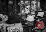 Image of family listening to radio broadcast Paris France, 1950, second 26 stock footage video 65675044610